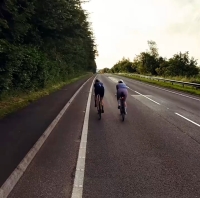 Two cyclists riding together