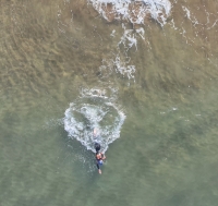 A swimmer seen from above in clear water