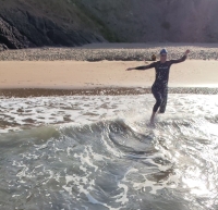 An athlete running into the sea